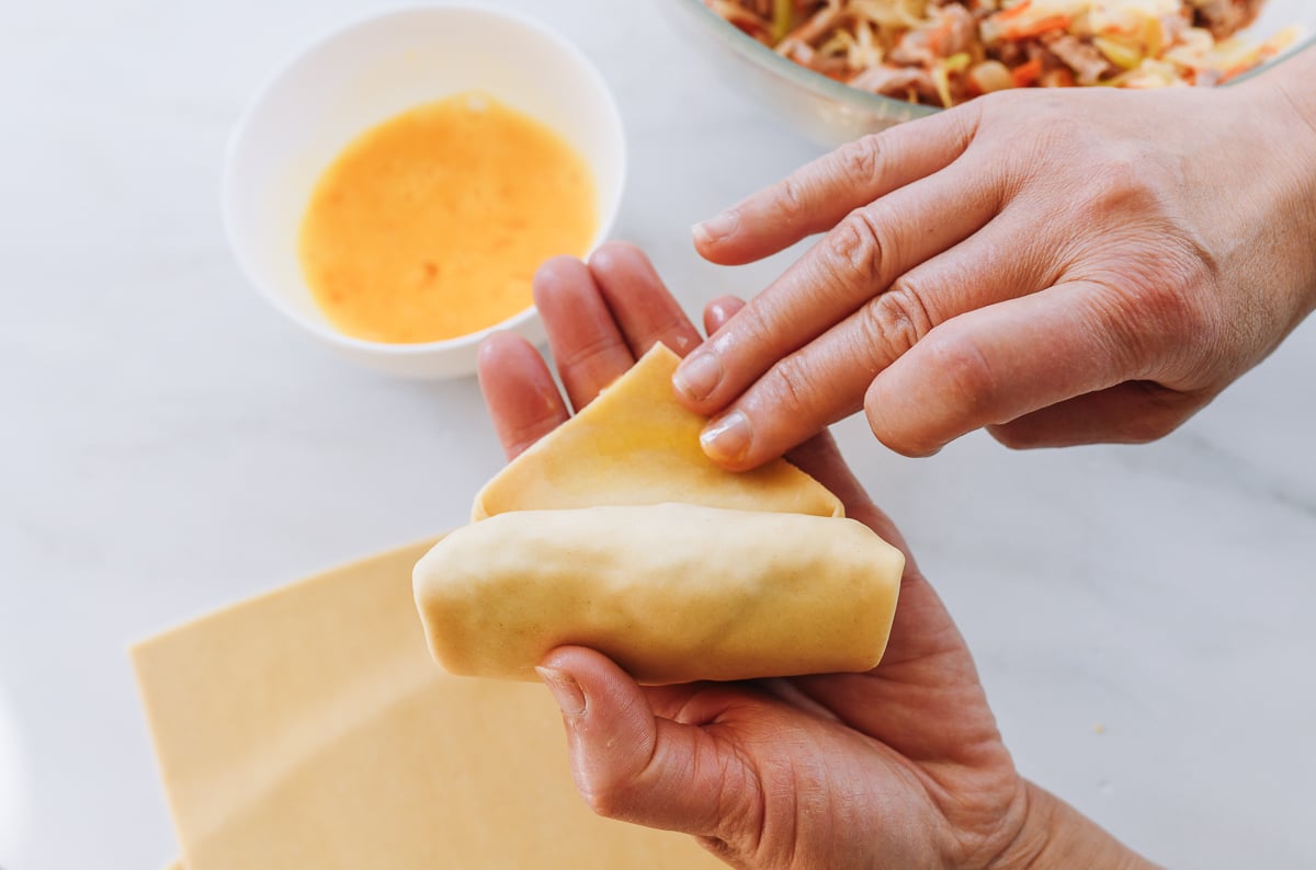 sealing egg roll with egg wash