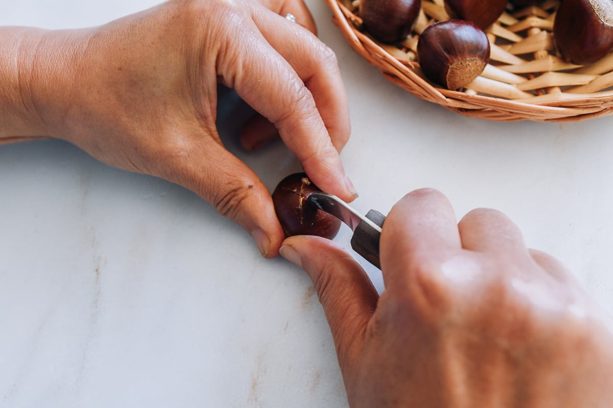 scoring chestnut with a chestnut knife