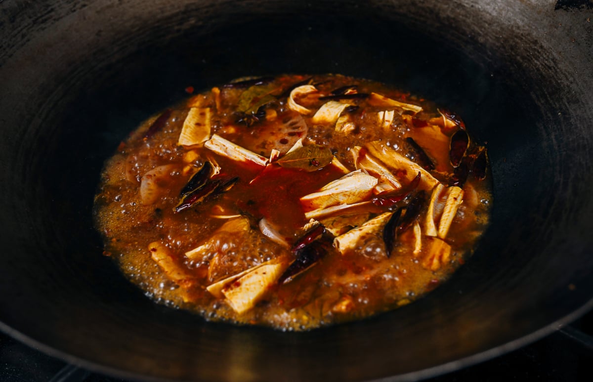 simmering vegetables and bean threads in spicy sauce