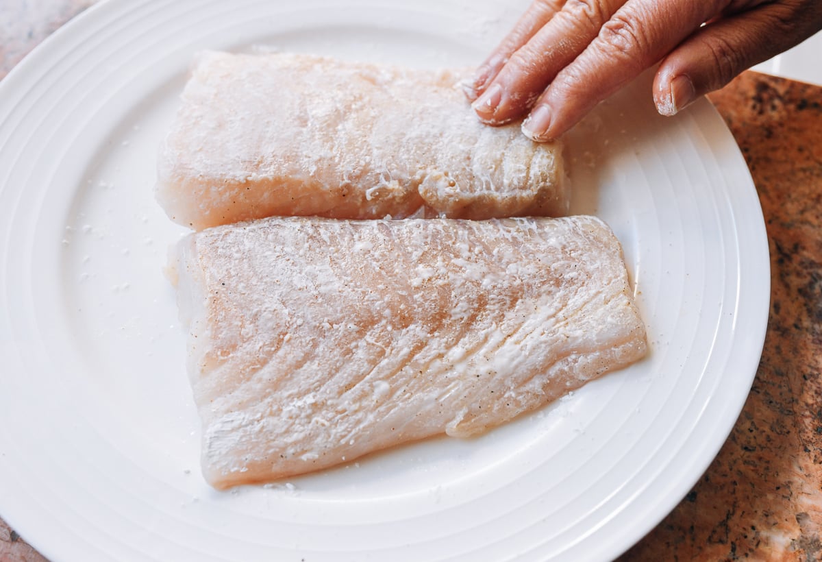 coating fish fillets in thin layer of cornstarch