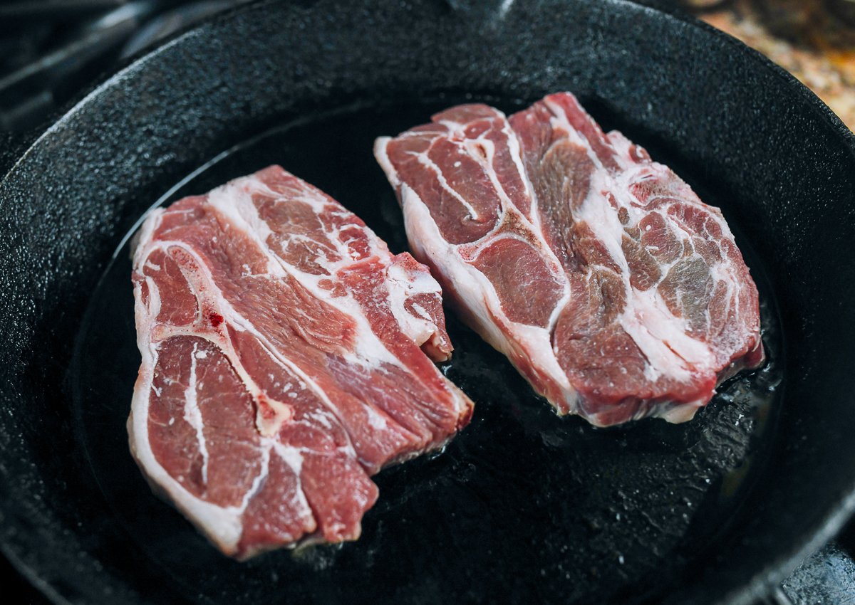 lamb shoulder chops in cast iron pan