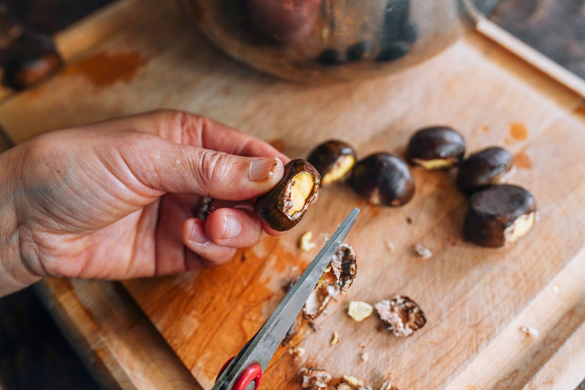 Part of chestnut shell cut off with kitchen shears